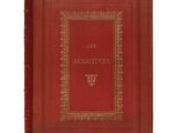 a red book with gold trimming on the cover