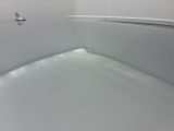 a white toilet with a white seat in a bathroom