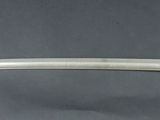 a close up of a sword with a gold handle