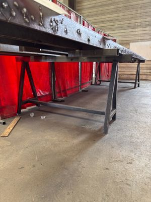 an image of a long table in a warehouse