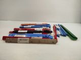 a pile of assorted colored pencils sitting on a table