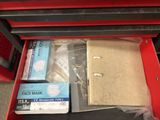 a red box with a lot of items inside of it