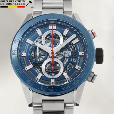 a close up of a wrist watch with a blue face