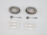two spoons, a spoon and a spoon rest on a table