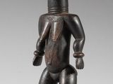 an image of a wooden figure of a woman