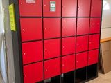 many red lockers in a room with a white wall