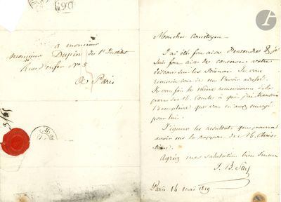 un vieux document portant un cachet de cire rouge