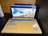 a box of a sewing machine sitting on a table