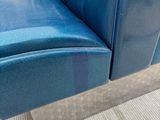 a blue chair that is sitting on the floor