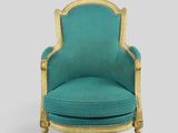 a blue chair with gold trim and a green upholstered seat