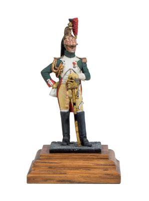 figurine of a soldier with a sword on a wooden base