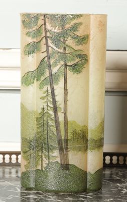 a picture of a vase with a picture of trees on it