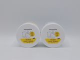 a pair of white plastic containers with yellow labels on them