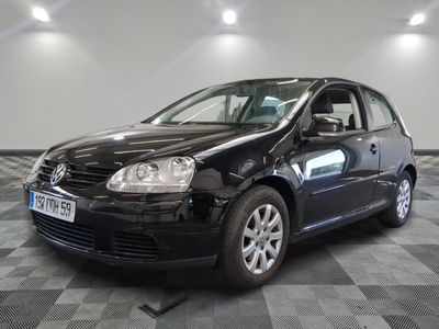 a picture of a black car parked in a showroom