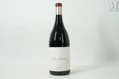 a bottle of wine that is sitting on a table