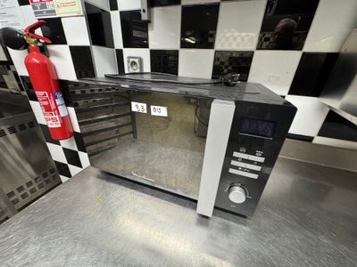 un extincteur posé sur le plan de travail de la cuisine