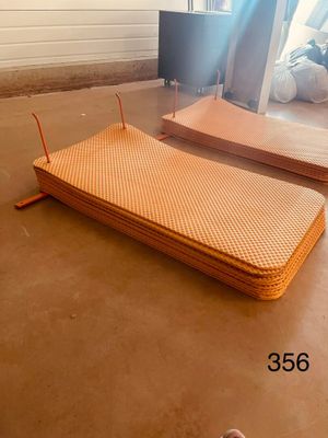 two mattresses that are on the floor in the room
