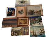 many pictures of boats and ships on display on a white surface