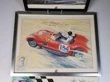 painting of a red race car and a picture of a man in a racing car