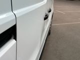 a white van that is parked in a parking lot