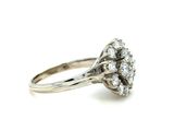 an image of a diamond clustered ring on a white background