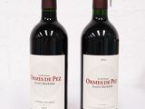 deux bouteilles de vin posées l'une à côté de l'autre sur une table
