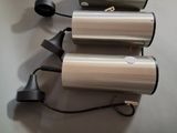 three different types of blow dryers on the wall