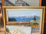 Deux tableaux représentant une maison et un bateau sont posés sur un tapis