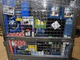 a metal cart with many items in it in a warehouse