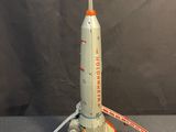 a toy rocket that is sitting on top of a table