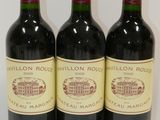 three bottles of wine sitting on top of a table next to each other