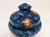 a blue and brown object on a white surface