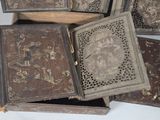 several wooden boxes with decorative designs are stacked on top of each other