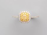 a yellow diamond and diamond ring
