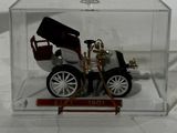a small model of a car in a clear box