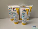 trois tubes de crème solaire CeraVee posés sur une table