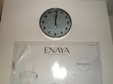 a clock that is on the wall above a sign