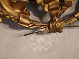 a gold clock that is sitting on a table
