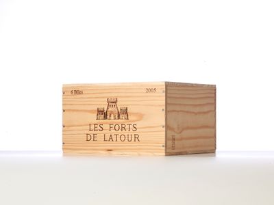 a wooden box with a logo on it on a table
