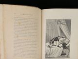 an open book with a picture of a woman and two children