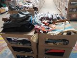 a carton filled with clothes and other items in a store