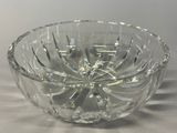 a glass bowl that is sitting on a table