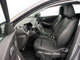 the interior of a car with the front seats down and the center console in the passenger seat