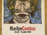the poster for marilyn combats is displayed on the table