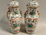 pair of chinese vases with birds and flowers painted on them