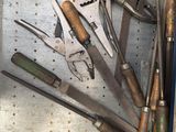 many different tools in a metal box on the table