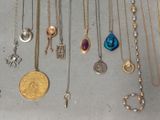 a lot of necklaces that are on a table