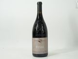 a bottle of wine that is sitting on a table