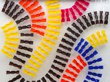 a lot of different colors of hair clips on a table