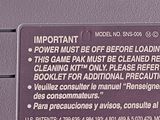 a close up of a purple game console with instructions on it